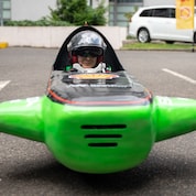 Shell go kart on track.