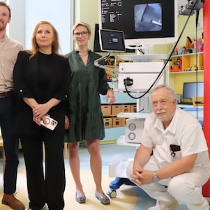 Team photo inside the clinic with shell logo