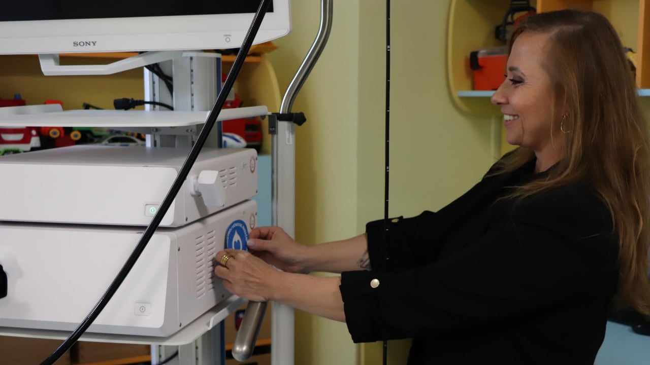Women pasting sticker on medical equipment