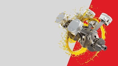 Motor auta v kolečku z oleje na šedo-červeném pozadí.
