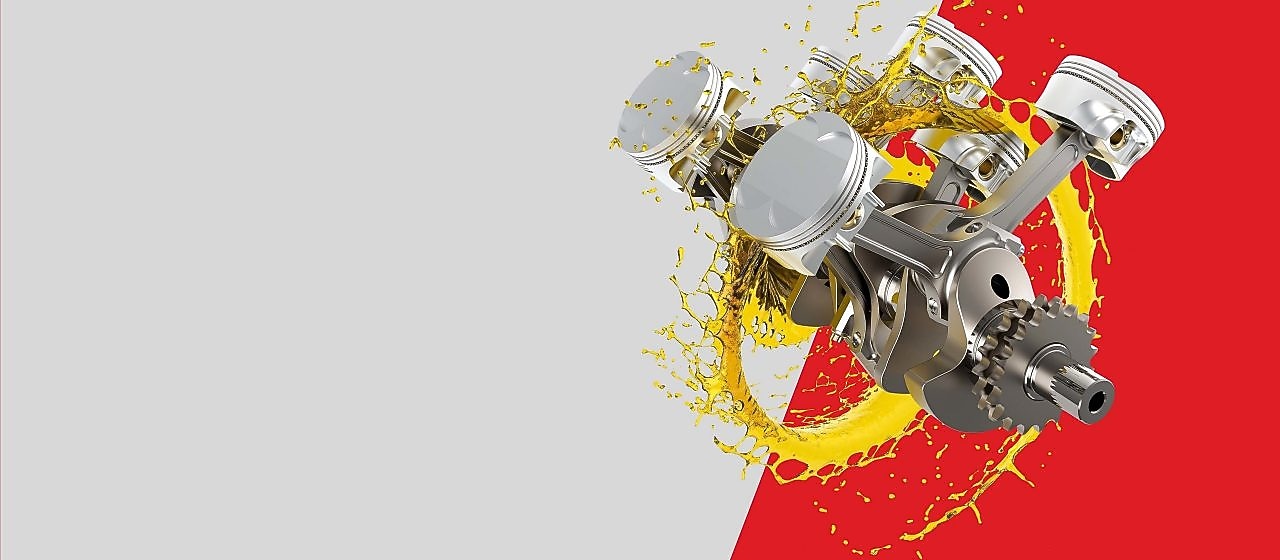 Motor auta v kolečku z oleje na šedo-červeném pozadí.